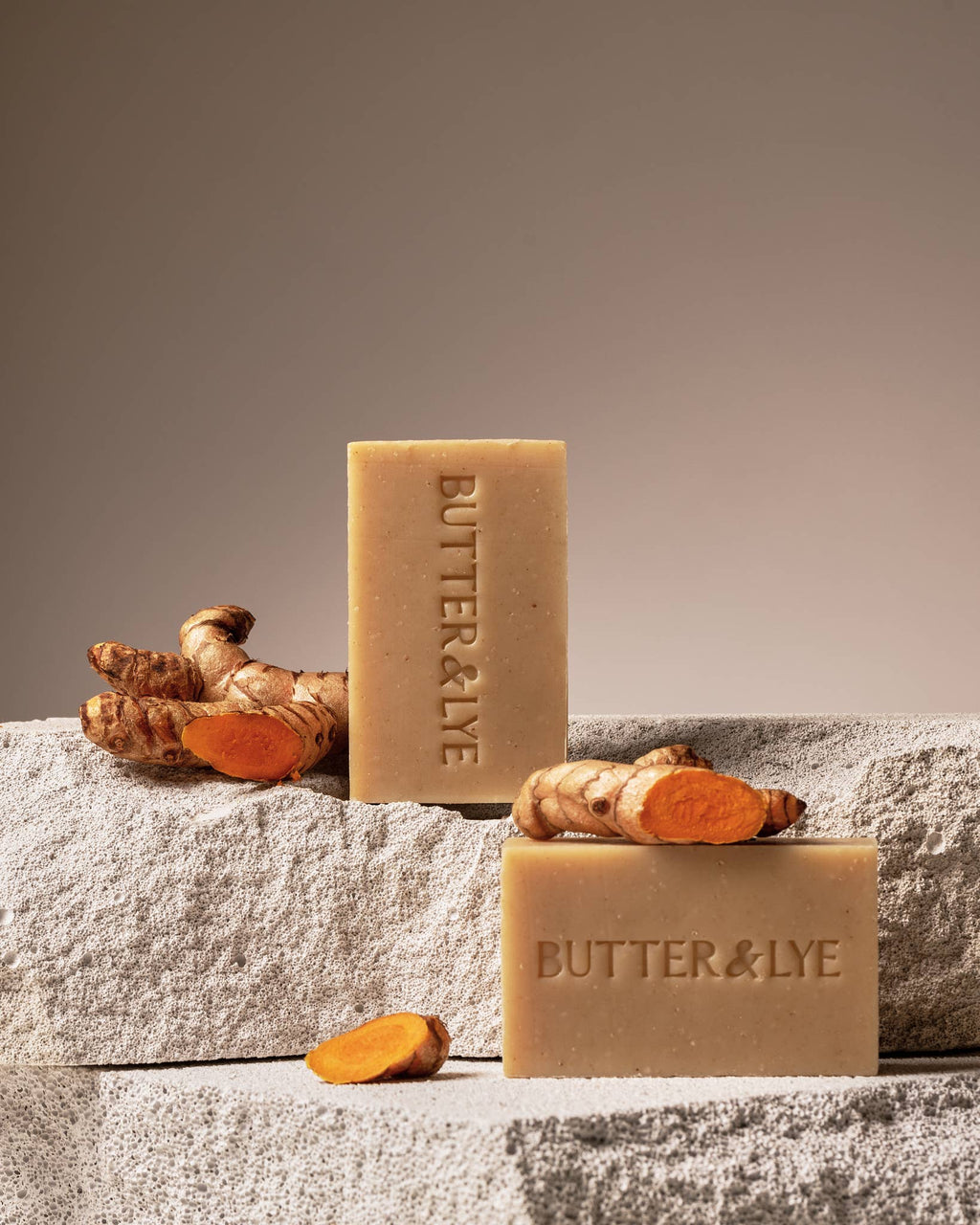 All-natural anti-inflammatory turmeric facial soap bars styled with natural decor