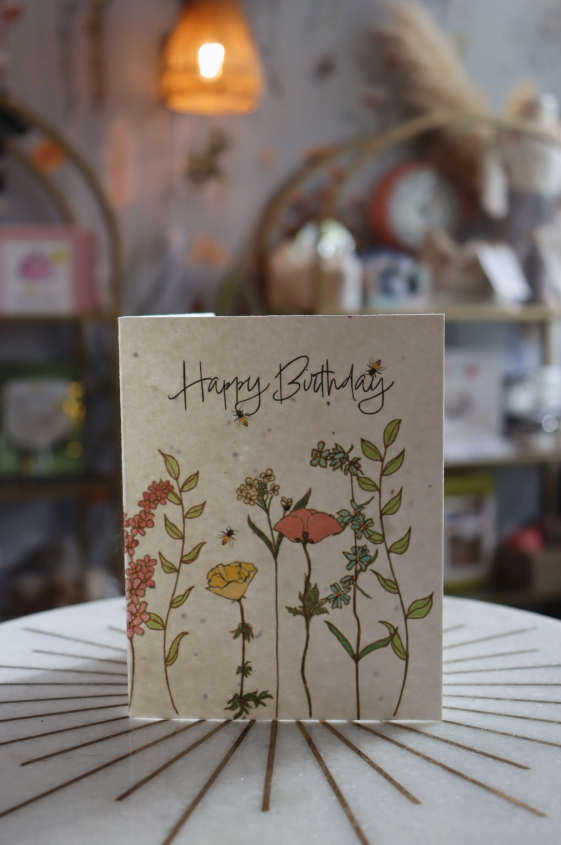 Zero-waste plantable seed paper birthday card made from 100% PCW recycled paper embedded with wildflower seeds.