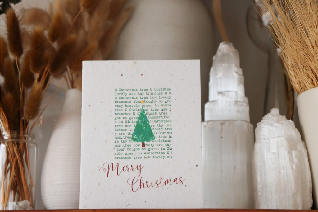 Eco-friendly plantable Christmas cards made from recycled seed paper that grows wildflowers in spring.