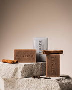 Radiant winter spice face and body soap bar by Butter & Lye styled with cinnamon sticks