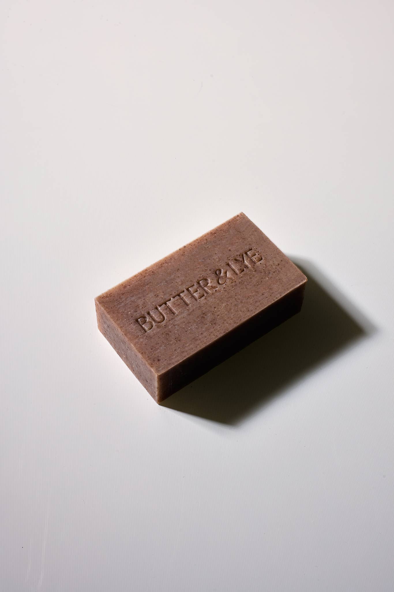 Butter & Lye plastic-free winter spice face and body soap bar with embossed logo
